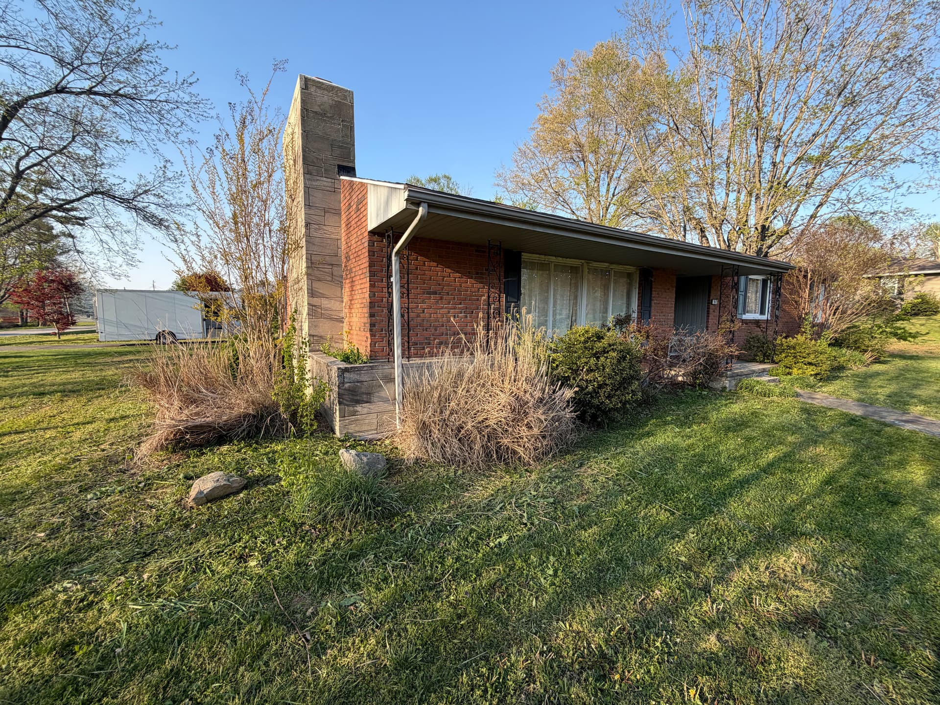 Gallery photos for Overgrown Bed Cleanup and Shrub Trimming at a Brick Home: Image #1